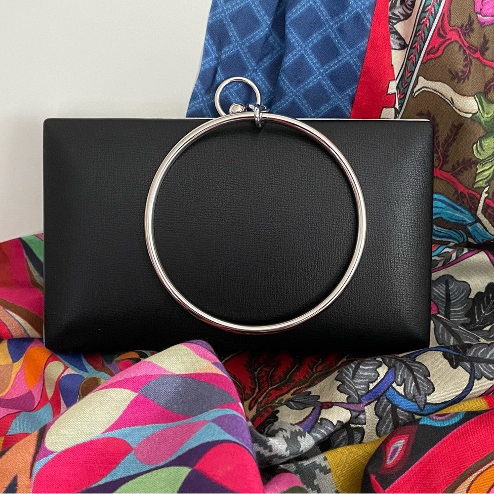 Beautiful black clutch with gold ring handle